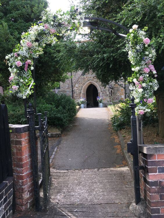 Church path archway wedding flowers